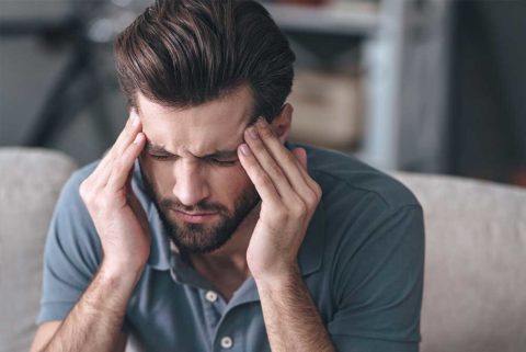 Man experiencing Headache